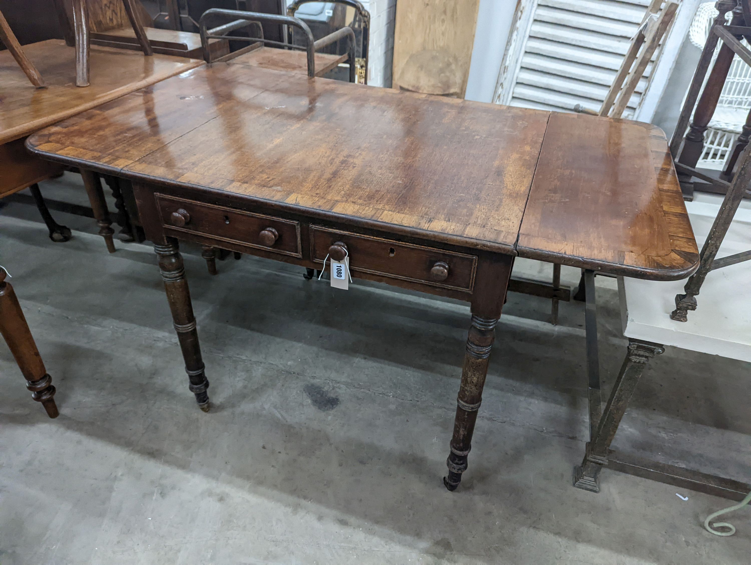 A Regency rosewood banded mahogany sofa table, 128cm extended, depth 75cm, height 73cm